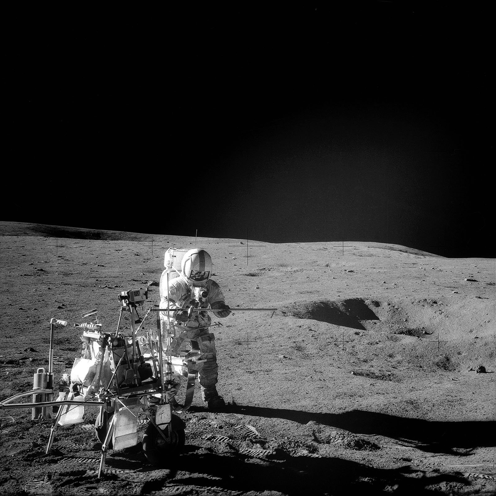 A photo of astronaut Shepard holding a core tube section