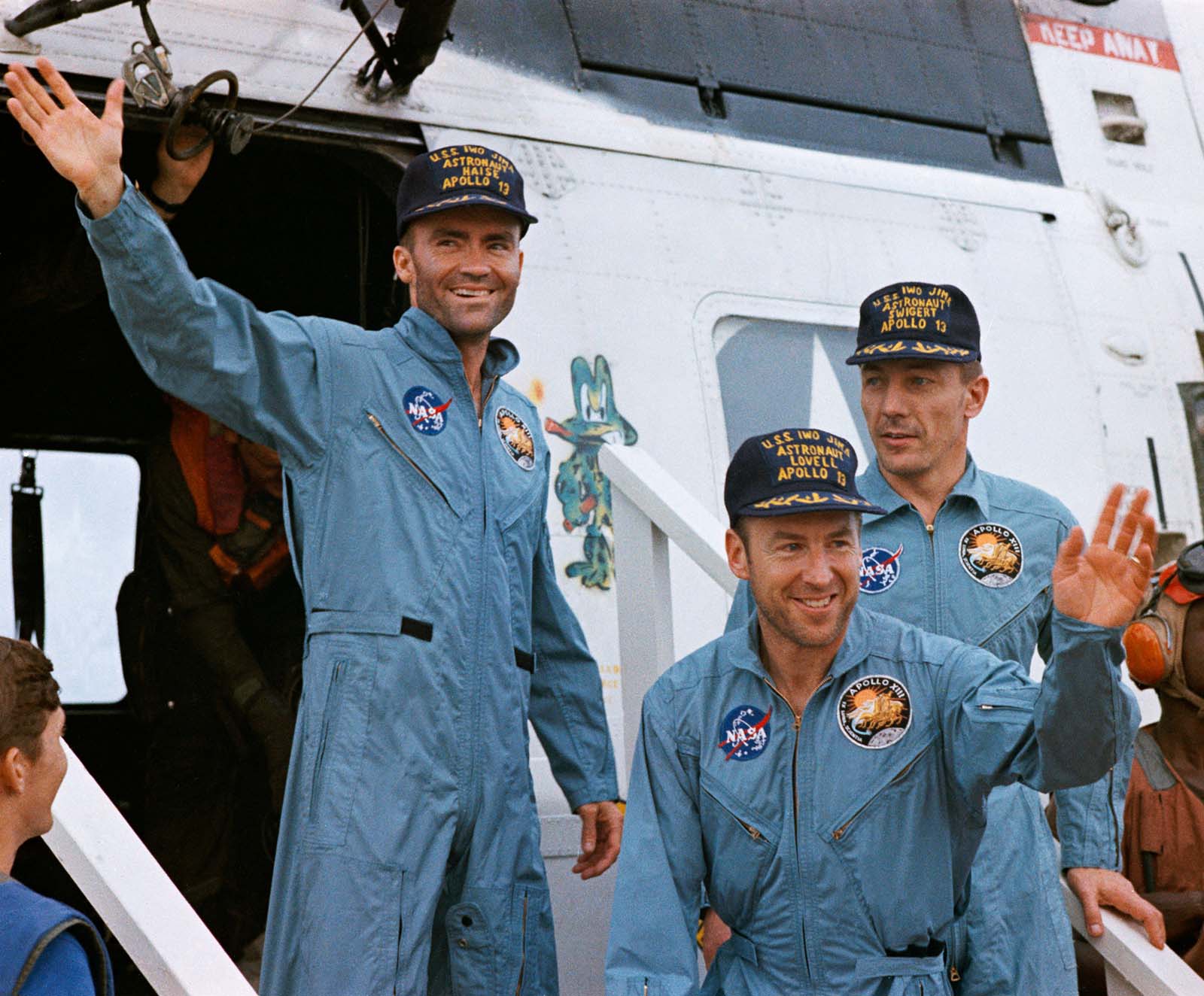 A photo of astronauts,Haise,Lovell, and Swigert