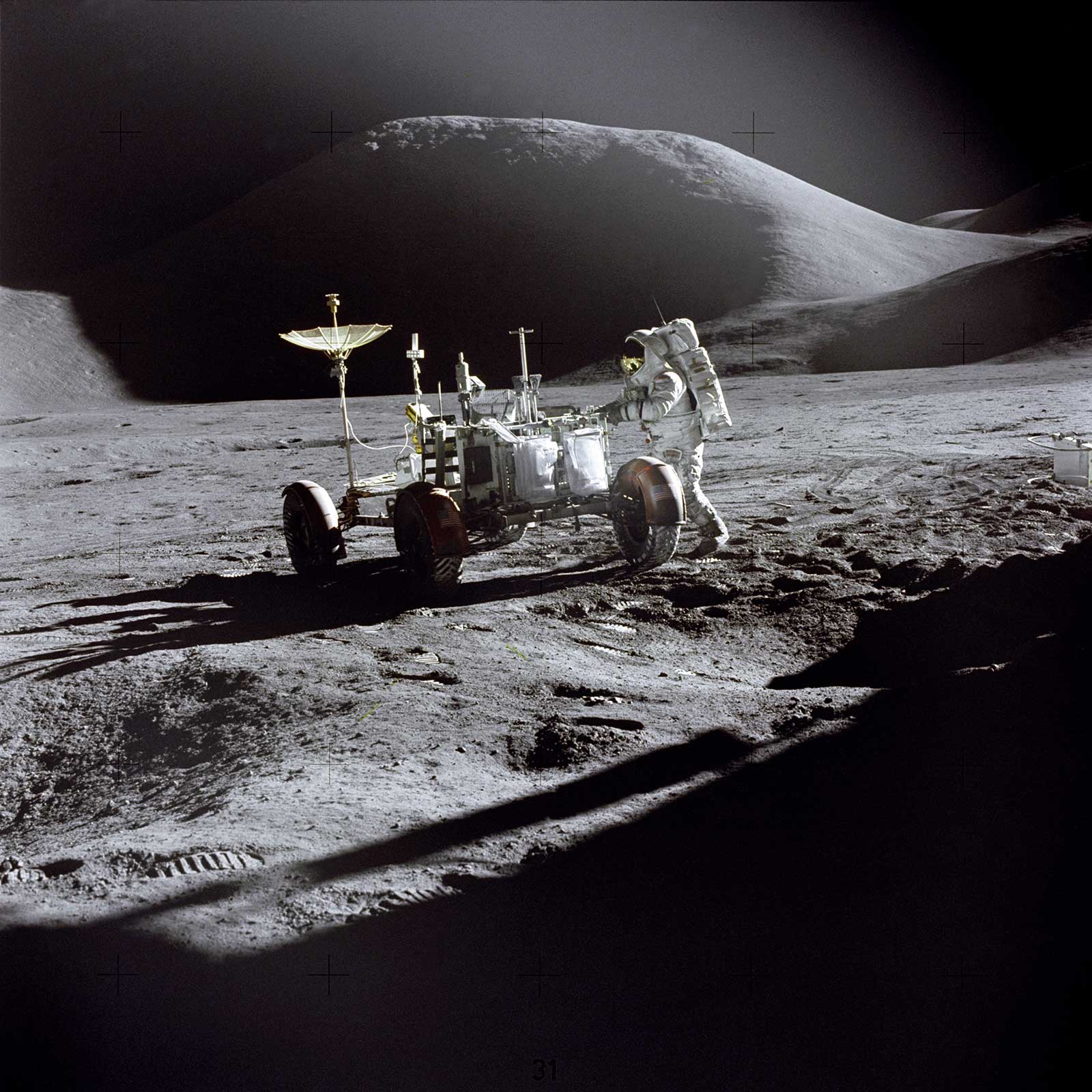 A photo of Apollo 15 astronaut Irwin setting up the Lunar Roving Vehicle