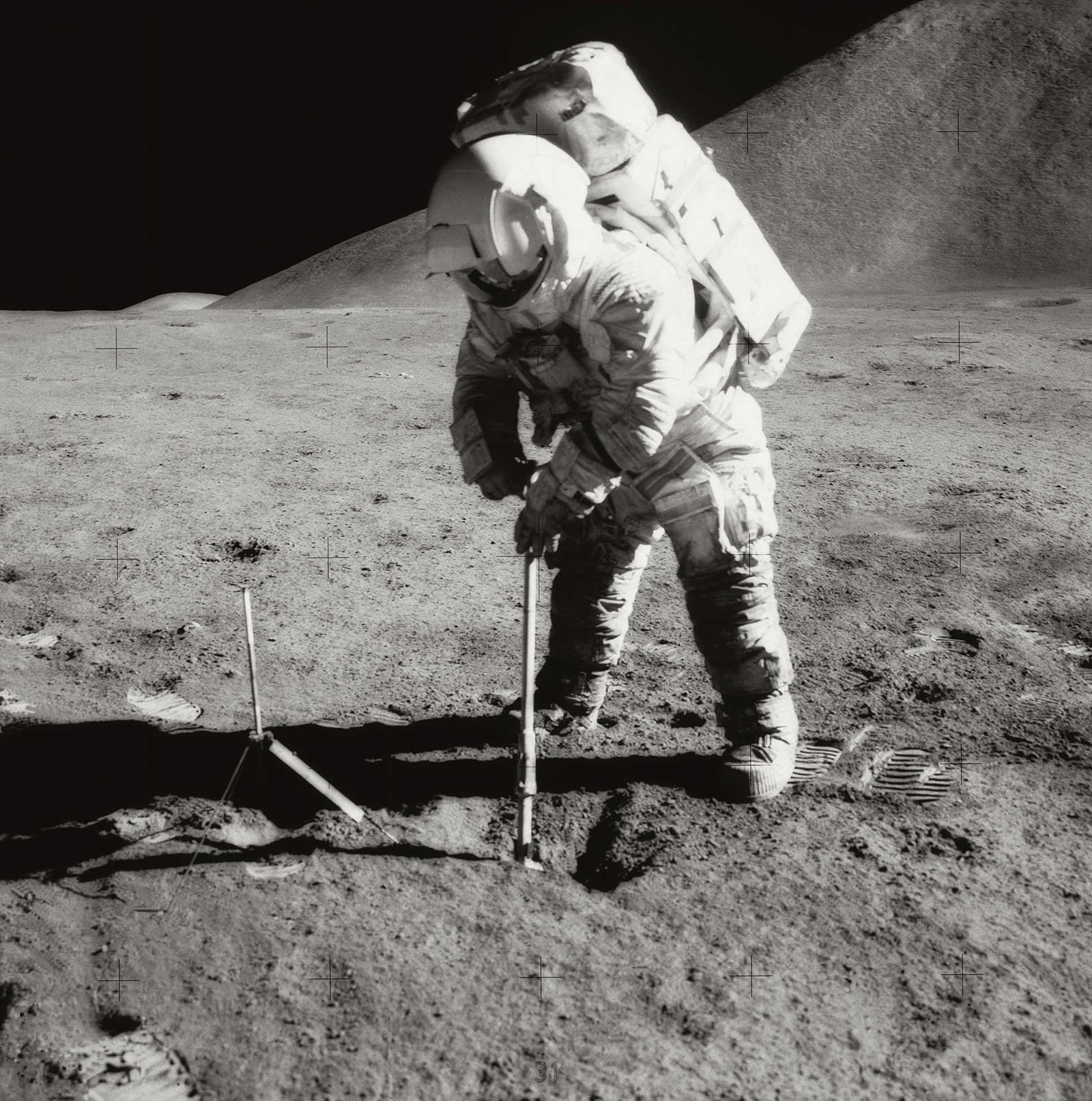 A photo of astronaut Irwin scooping samples