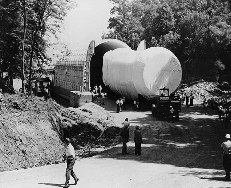 A photo of Saturn I being backed into its barge