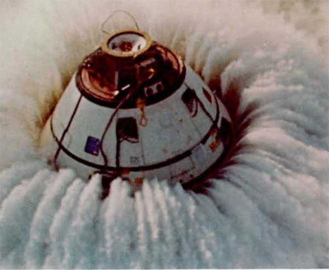 A photo of the command module floating in water