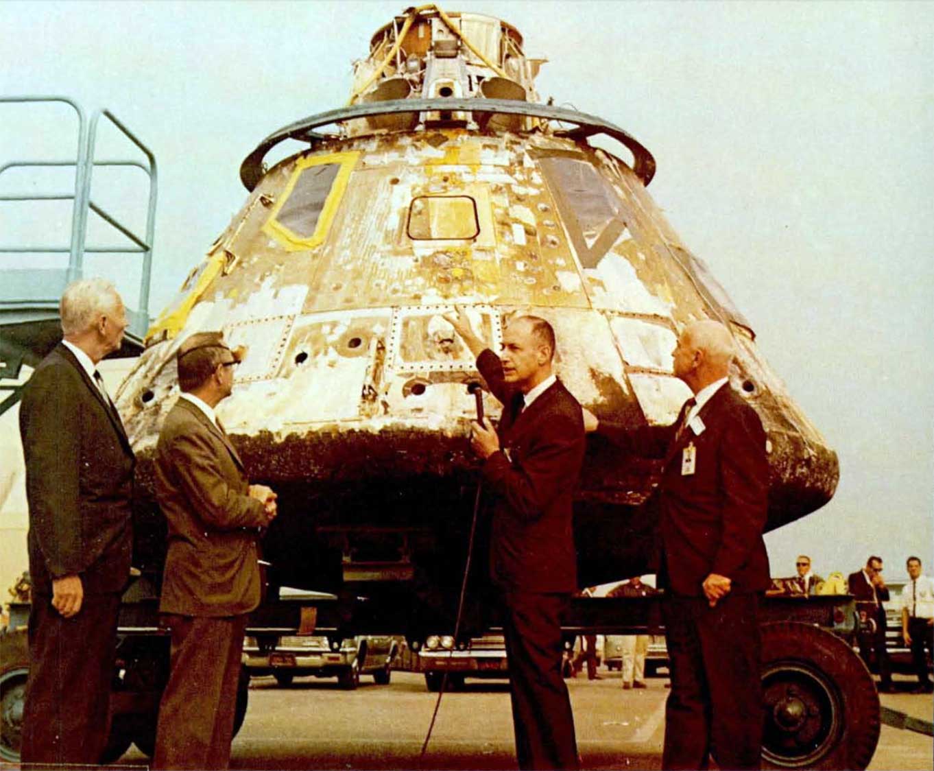 A photo of Ruud,Myers,Low and Gilruth inspecting the CM