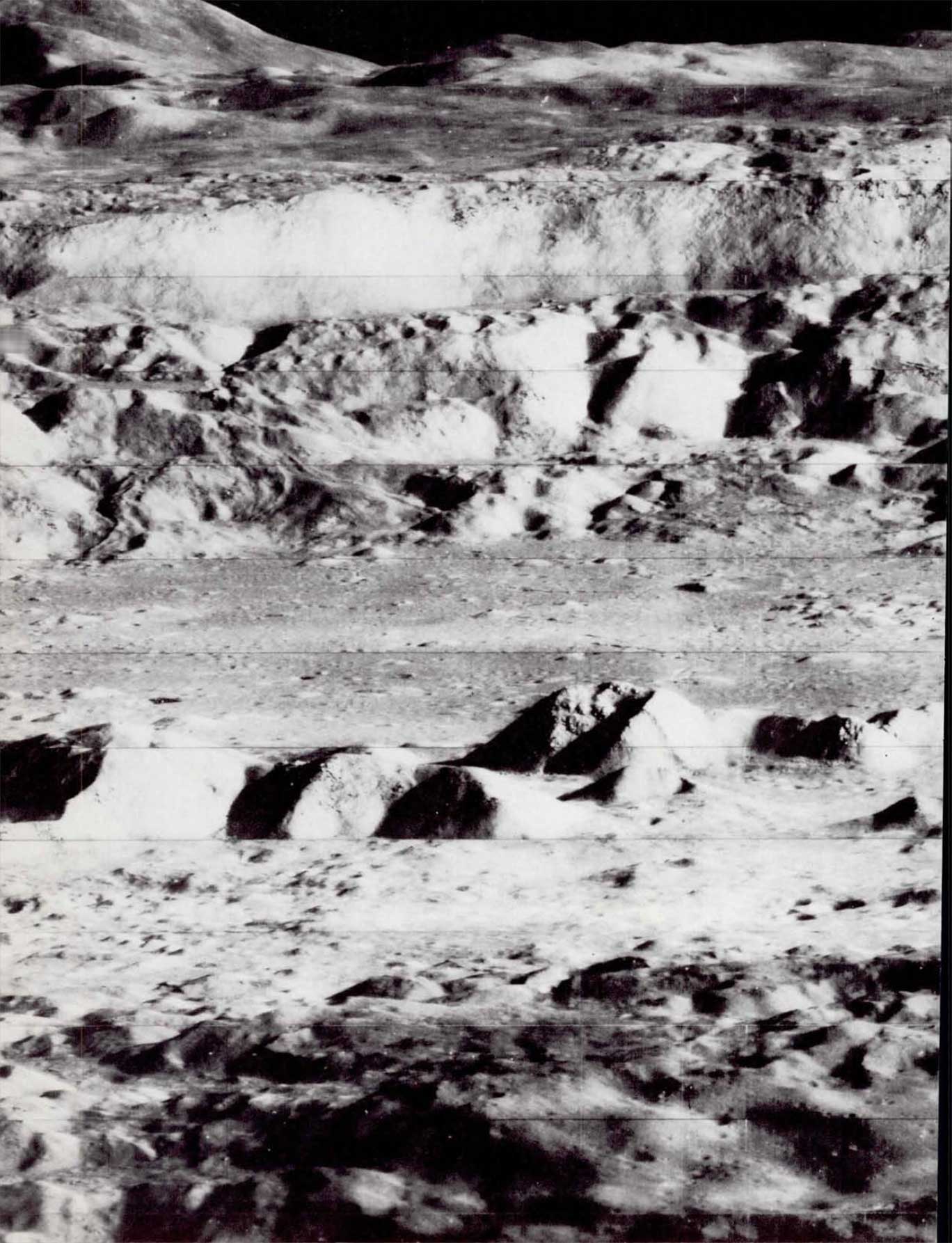 A photo of the landscape of the Moon with rolling mountains