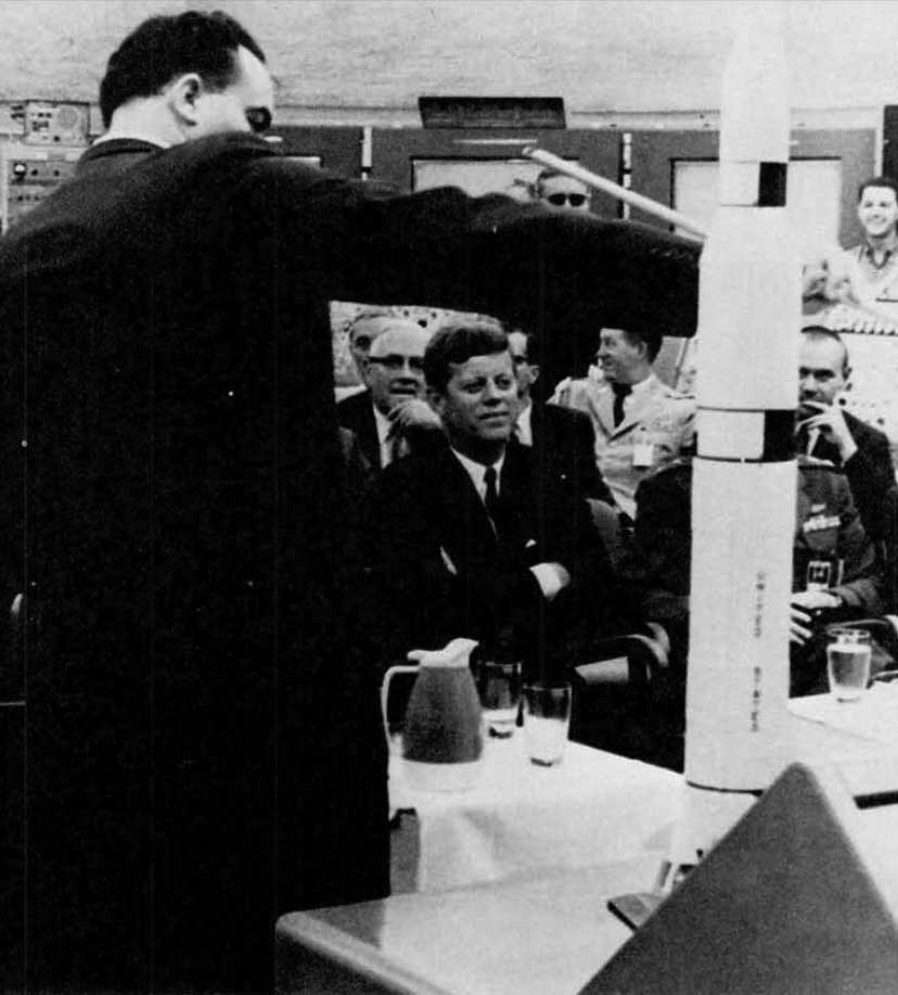 A photo of President John F. Kennedy being briefed on Launch Complex 39