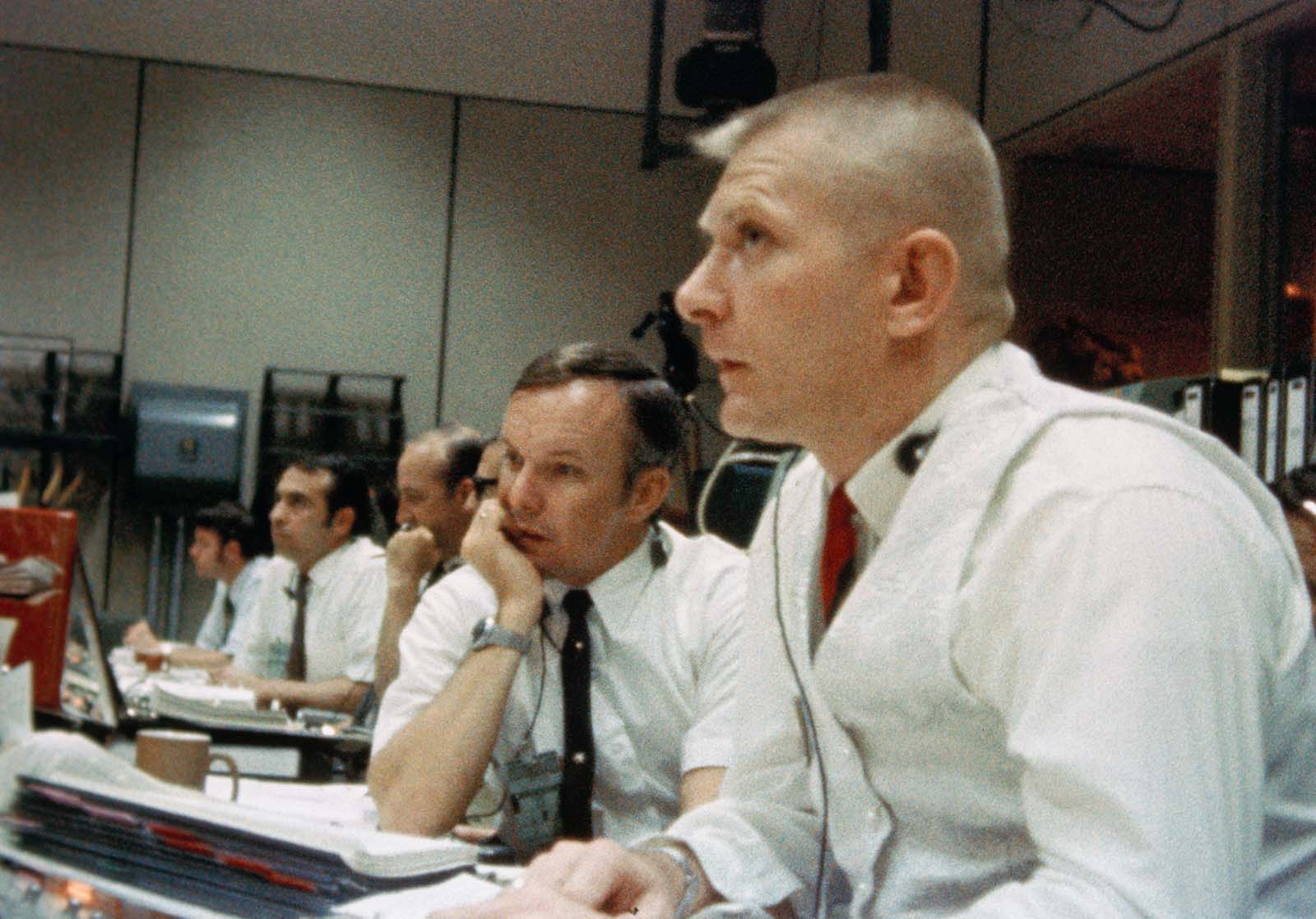 A photo of Flight Director Gene Kranz watching his console