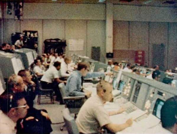 A photo of operation team members working in the Mission Operations Control Room