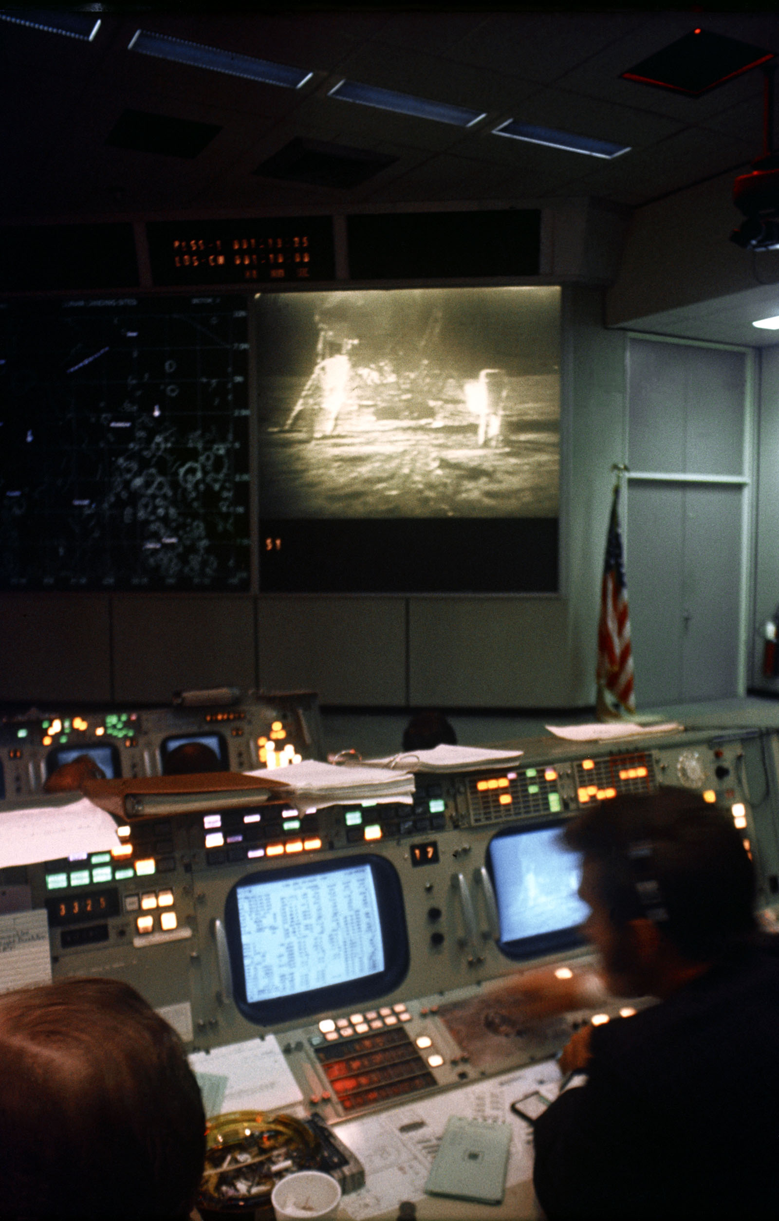 A photo of a television monitor at the front of Mission Operations Control Room