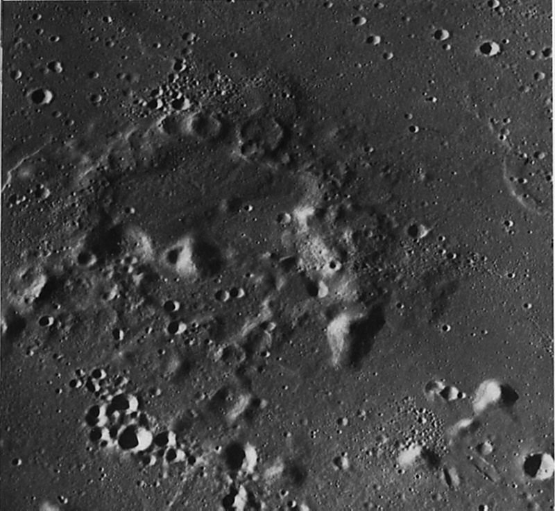 FIGURE 93. - Easily identifiable volcanic complexes like the one in figure 92 are not common, but some others have been recognized. This crudely circular belt of high-rimmed craters is located along the common boundary between Oceanus Procellarum and Mare Imbrium, about 130 km southwest of the crater Euler.