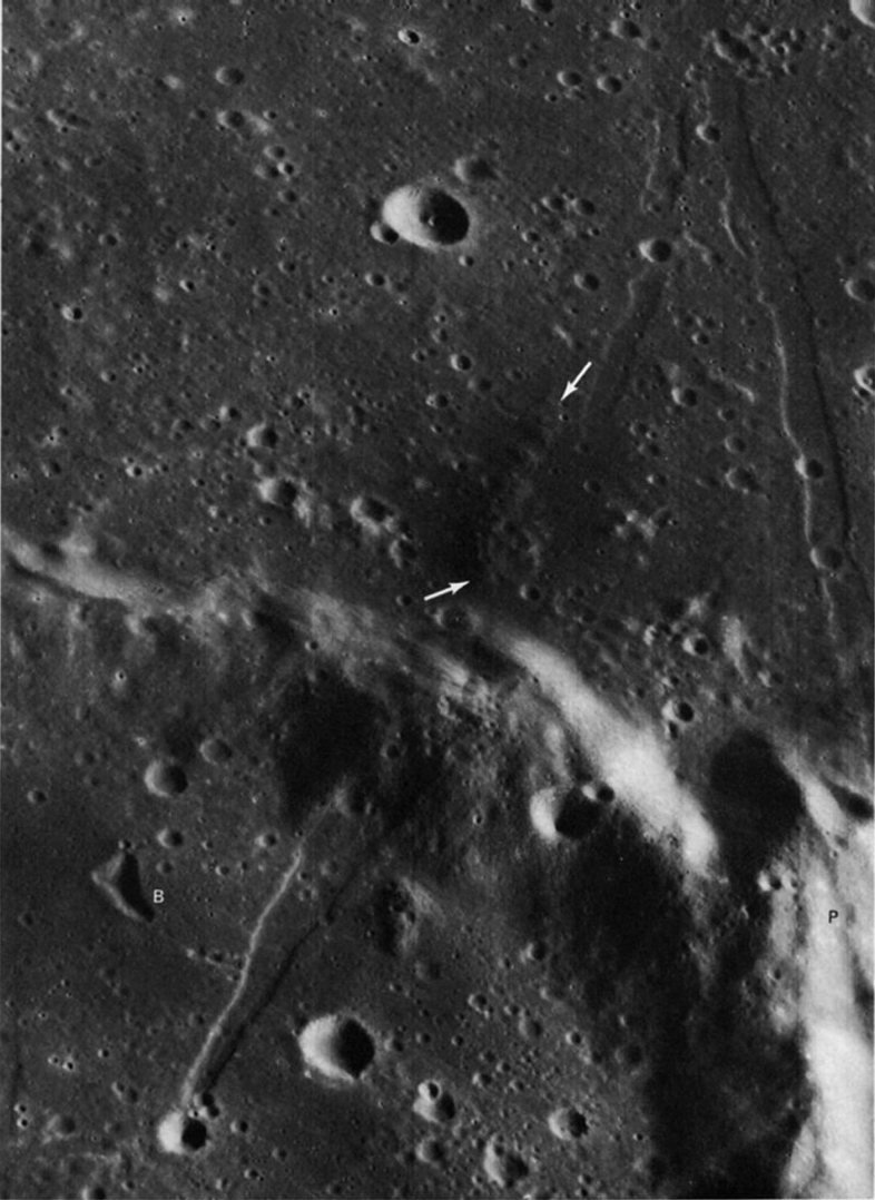 FIGURE 94. - Patches of dark material-presumably volcanic ejecta-are commonly associated with straight rilles or grabens.