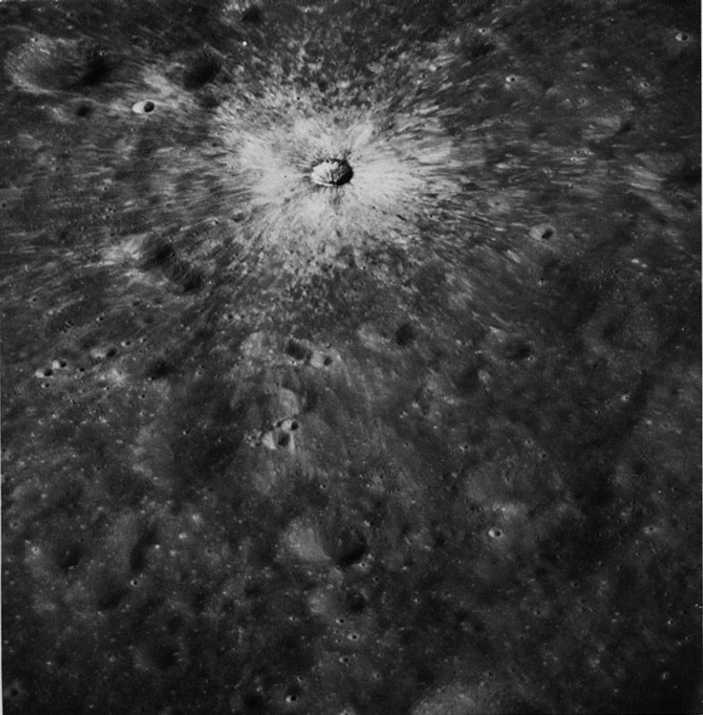 FIGURE 98. - This slightly oblique Hasselblad photograph, taken from Apollo 17, is an excellent view of a small, very young impact crater.