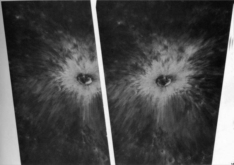 FIGURE 107. - The bright rays around this fresh 1.5-km crater on the Moon's far side show the effects of ejecta thrown out on rugged highlands.