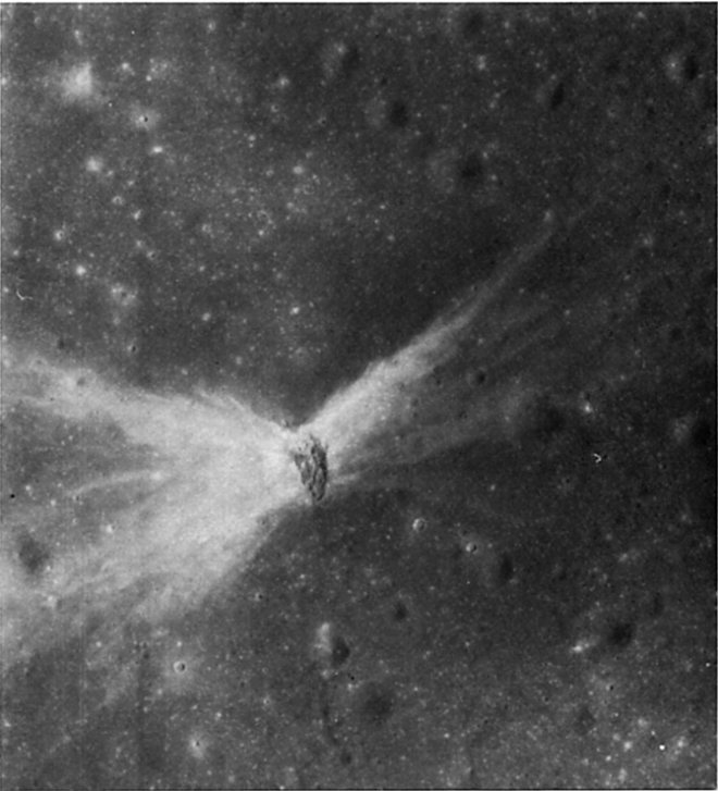 FIGURE 113. - This elliptical crater is 1 km long with an unusual, winglike pattern of rays.