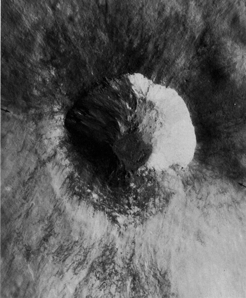 FIGURE 116. - Impact craters with asymmetric ray patterns and profiles can be caused by conditions other than the angle of trajectory.