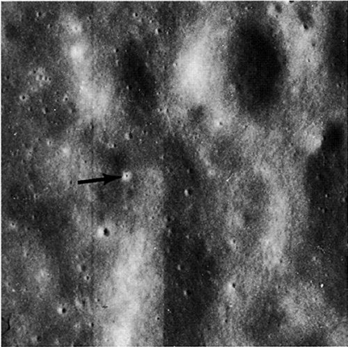 FIGURE 122. - An enlargement (approximately 15X) of a panoramic camera photograph showing a crater (arrow) formed in Mare Cognitum by the impact of the Ranger 7 spacecraft.