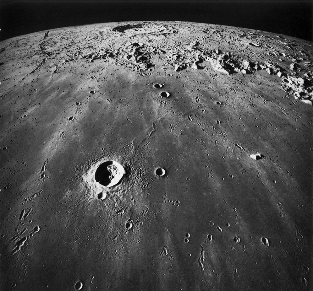 FIGURE 125. - This oblique view across southern Mare Imbrium looks toward Copernicus, the large crater near the horizon. 