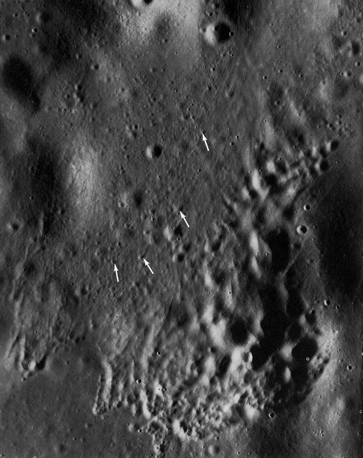 FIGURE 129. - The secondary crater cluster near the lower edge of figure 128 is enlarged to show more detail.