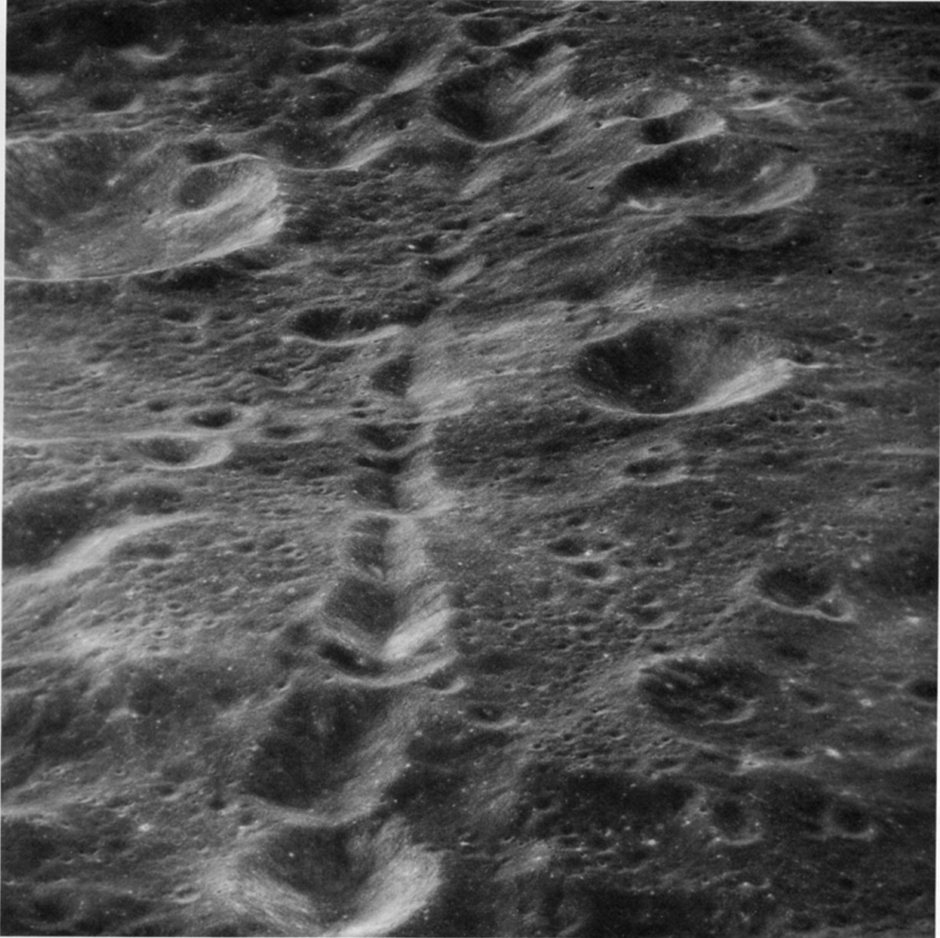 FIGURE 134. - This oblique view taken with the Hasselblad camera shows a crater chain on the far side, about 500 km north of Tsiolkovsky. 