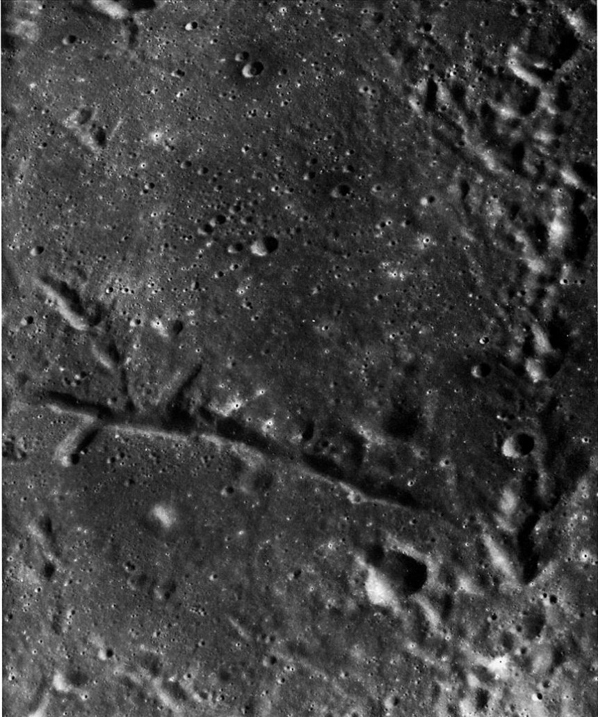 FIGURE 136. - Linear features of external and internal origin are contrasted in this area of southernmost Mare Tranquillitatis.