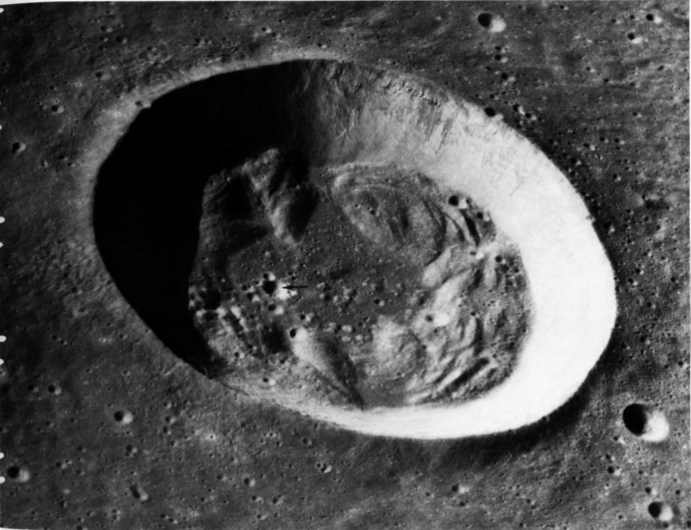 FIGURE 145. - Outcrops of layered rock are strikingly evident in the upper part of the far wall of the crater Bessel (17- km diameter) in south-central Mare Serenitatis.