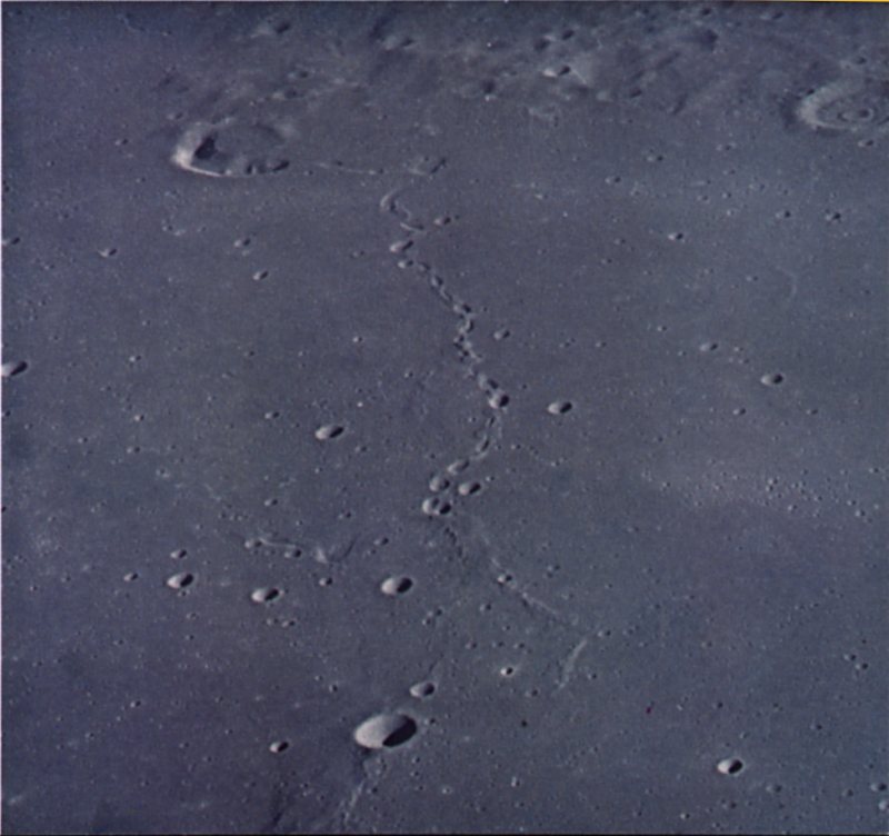 FIGURE 197. - A number of mare related features are present in this oblique view looking north across a mare surface between Mare Imbrium and Oceanus Procellarum. 