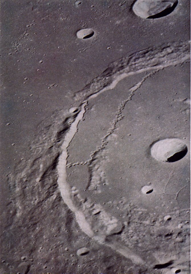 FIGURE 207. - The large (approximately 100 km) crater Posidonius is filled with mare lava to a level higher than the surrounding surface of Mare Serenitatis.