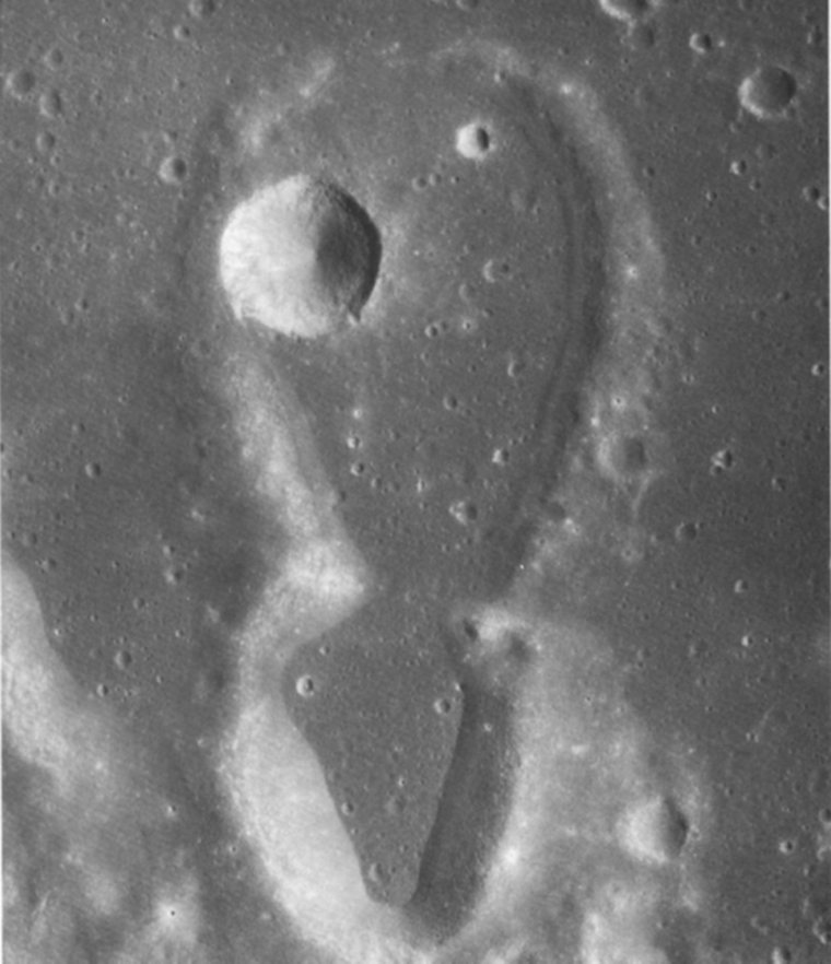 FIGURE 229. - This 18-km-long <<figure 8>> pair of noncircular craters near the crater Guericke probably was not formed by hypervelocity impacts of bodies from space. 