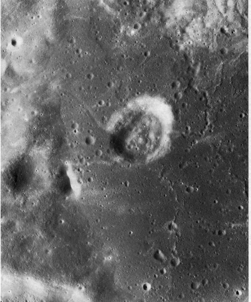 FIGURE 240. - This photograph shows part of the floor and walls of the largest (90 km) crater inside the old pre-lmbrian crater Gagarin on the far side of the Moon. 