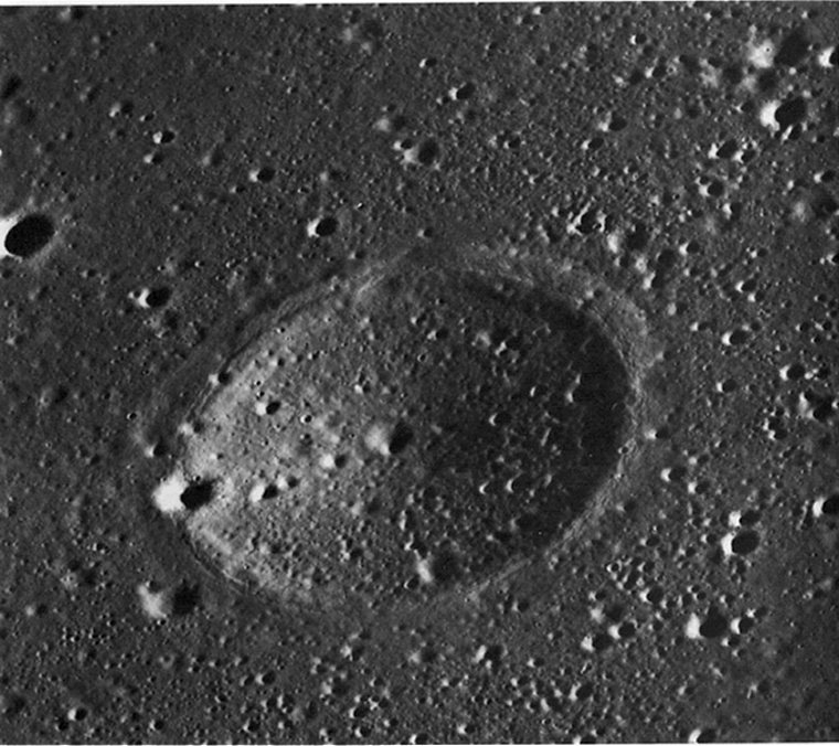 FIGURE 242. - This picture, showing an area in central Mare Serenitatis 200 km from the nearest outcrops of terra rocks, is an oblique view of a 4-km diameter crater form about 200 m deep.