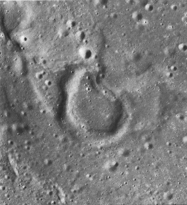 FIGURE 243. - This rimmed depression draped by mare lava is at the end of a mare ridge segment due north of Copernicus in Mare Imbrium. 