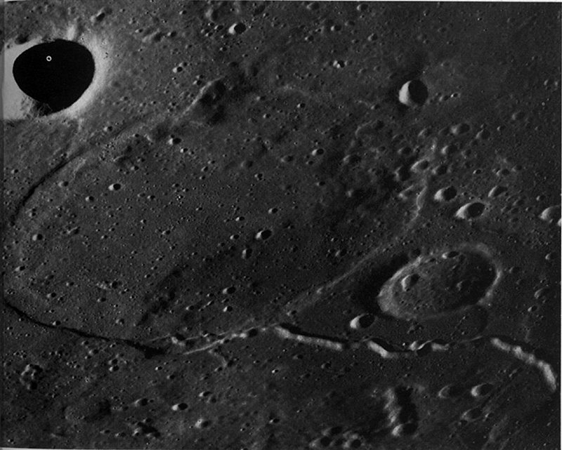 FIGURE 244. - This oblique photograph shows the buried crater Jansen R in northern Mare Tranquillitatis. 