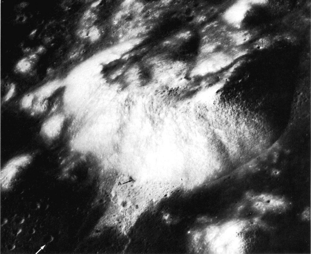 FIGURE 39. - This mountain mass, called South Massif, on the southeastern rim of the Serenitatis basin towers 2000 m above the Apollo 17 landing site at the bottom left of the picture (arrow).