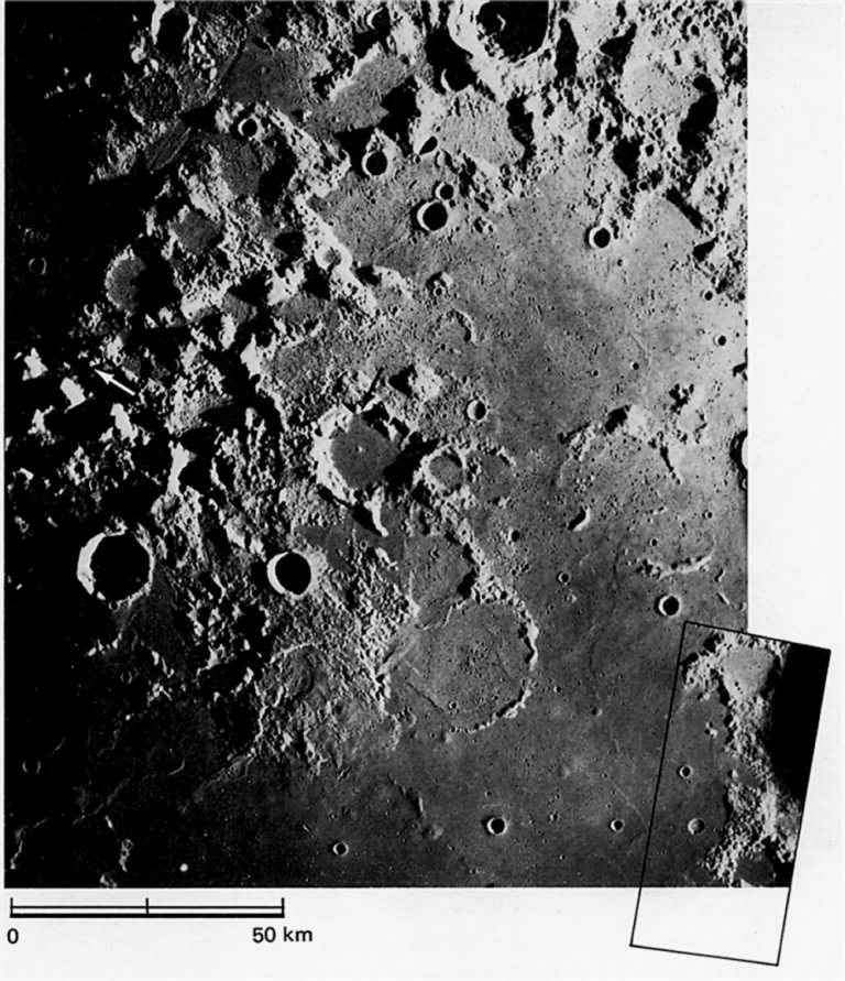 FIGURE 50. - Between Mare Crisium and Mare Serenitatis Apollo 17 approached its eventual landing site, which is in shadow at the left edge of the photograph (white arrow).