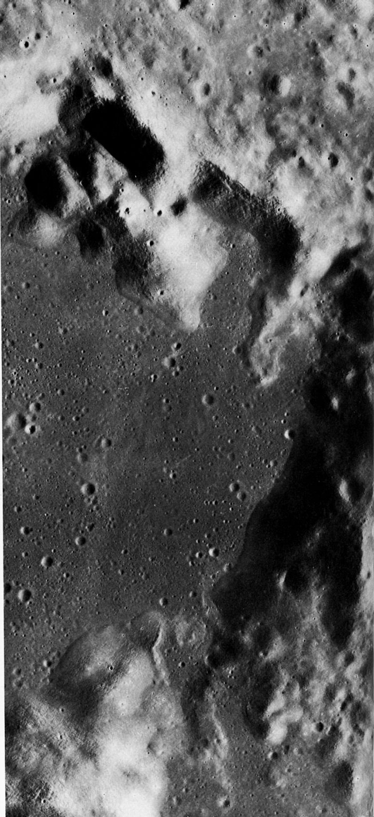 FIGURE 52. - Maraldi, a 45 km impact crater, was shown in its regional context in figure 50. Its rectilinear shape is in striking contrast to the circular or oval shape of most lunar impact craters.