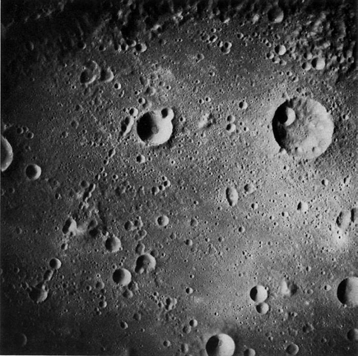 FIGURE 56. - The very large crater or small multiringed basin Mendeleev is shown here at the same scale as the preceding two pictures of Ptolemaeus.