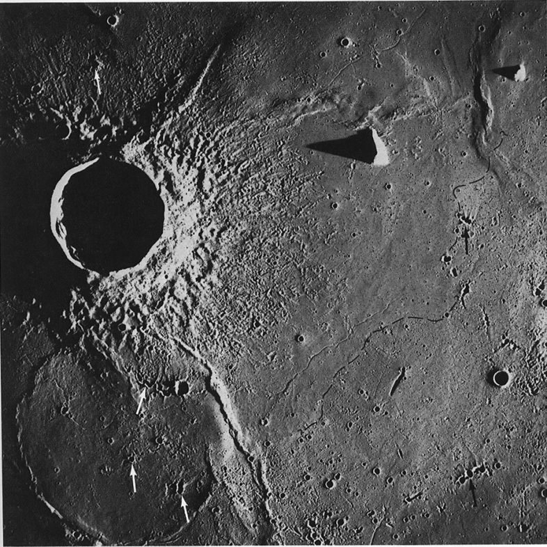 FIGURE 67. - This area is east of that covered in figures 65 and 66; the large crater is Lambert. Here also lava flows of more than one age are present.