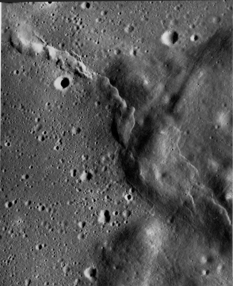 FIGURE 79. - In the upper left corner of the photograph, a lunar ridge heads in a southeasterly direction toward the dark mantling unit that rings Mare Serenitatis.