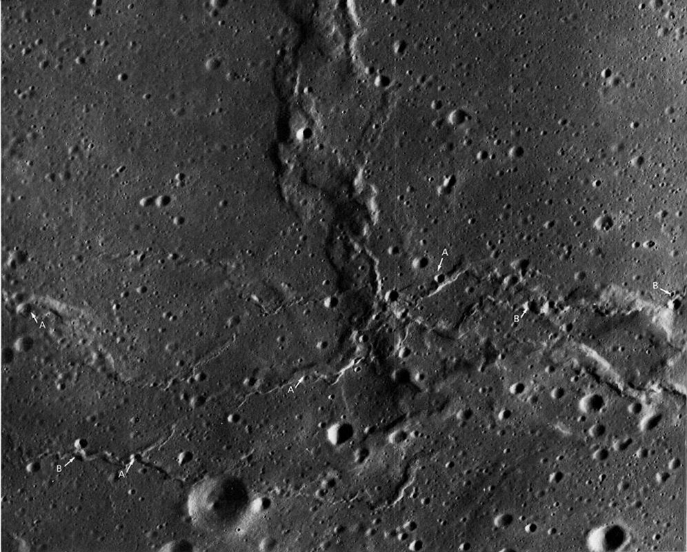 FIGURE 82. - These intersecting sets of mare ridges are near the western edge of Mare Serenitatis. One set of generally small, sharply defined lobate scarps and ridges trends irregularly east to west.