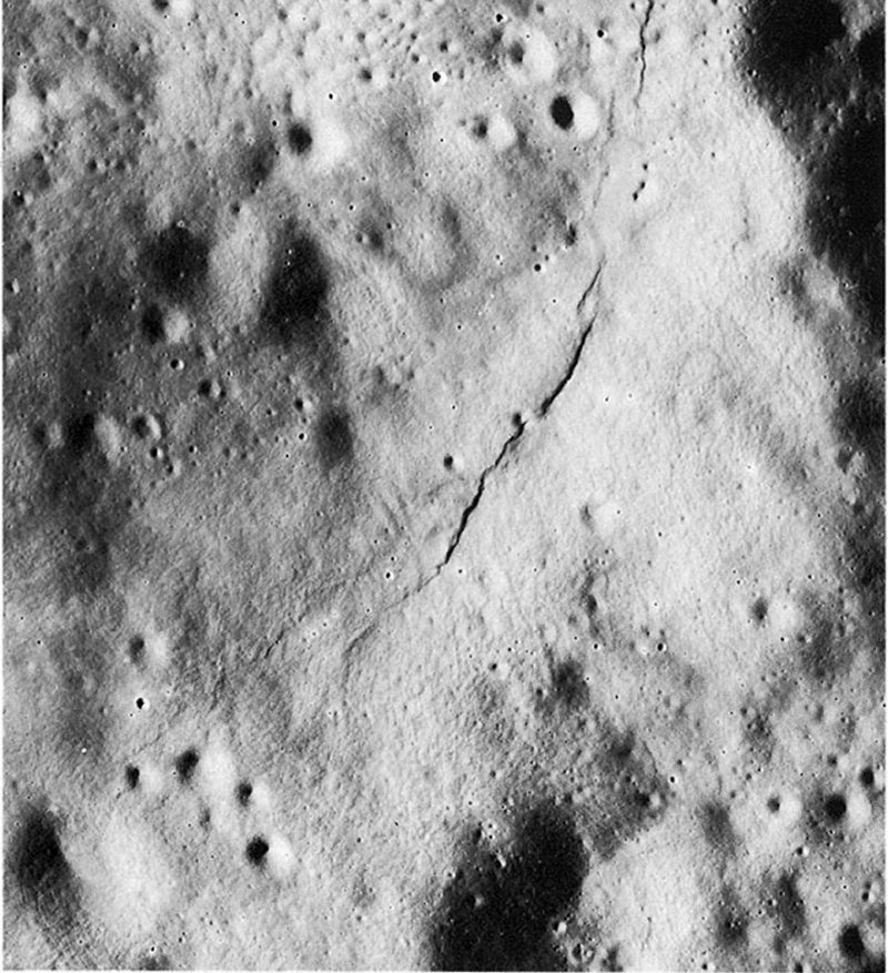 FIGURE 87. - This crenulate lobate scarp occurs within a small depression on the far side. 