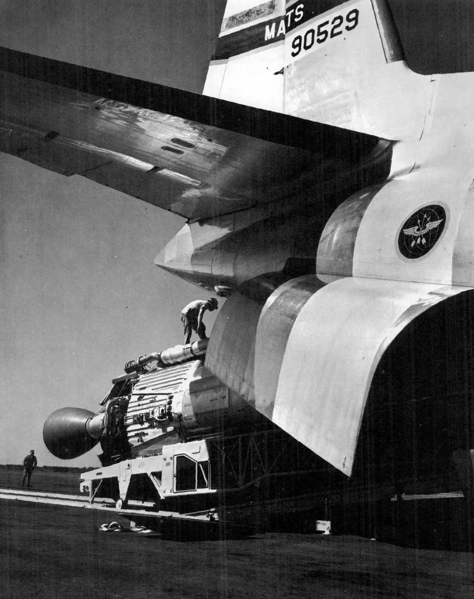 massive Atlas launch vehicle being offloaded from a large transport aircraft