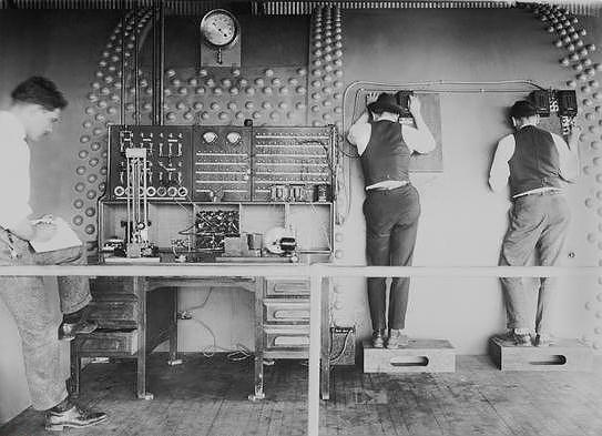 Wind tunnel operators observing  experiment