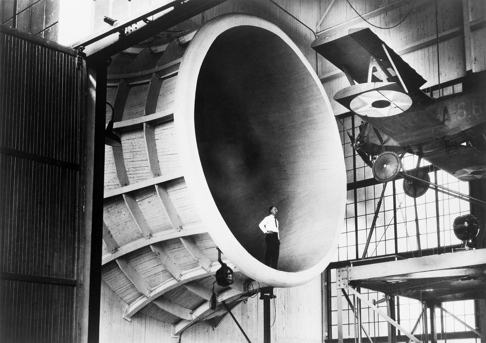 photo of a man standing in the opening of the propeller research tunnel