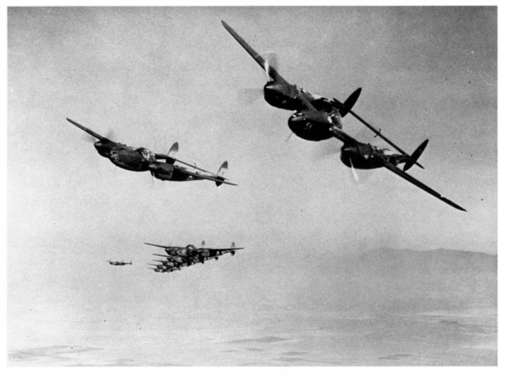 aerial photo of a squadron of P-38s 