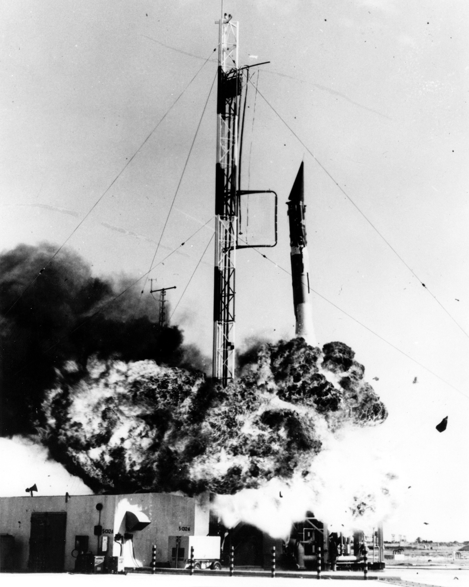 photo of Vanguard rocket collapsing in flames and smoke on the launch pad