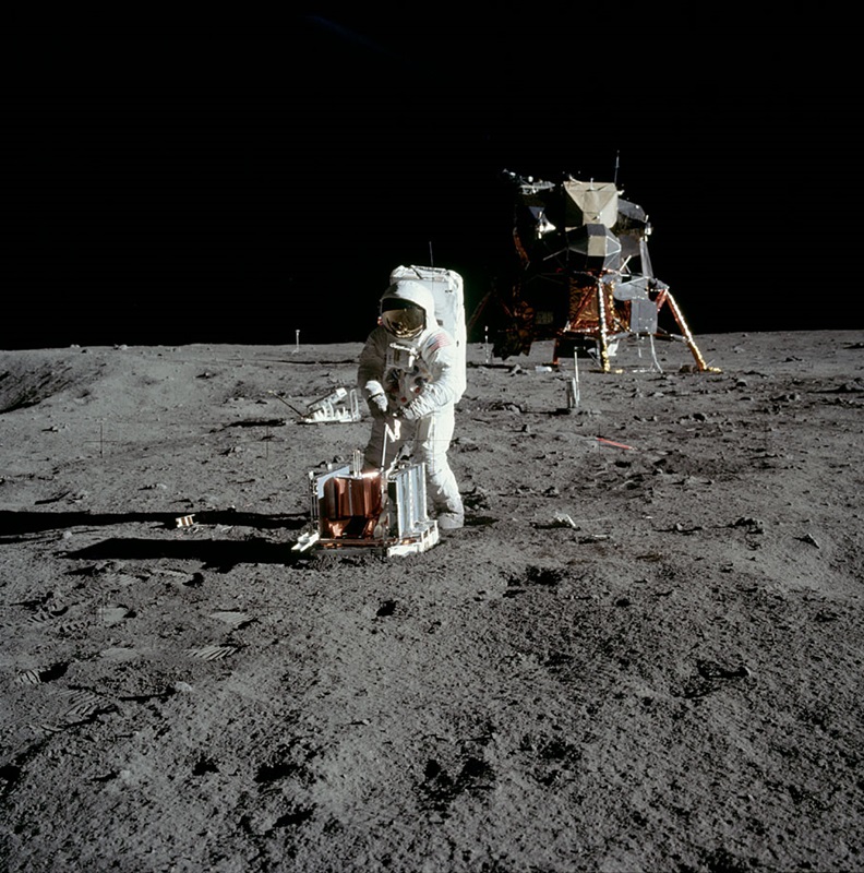 astronaut working on the desolate moon's surface